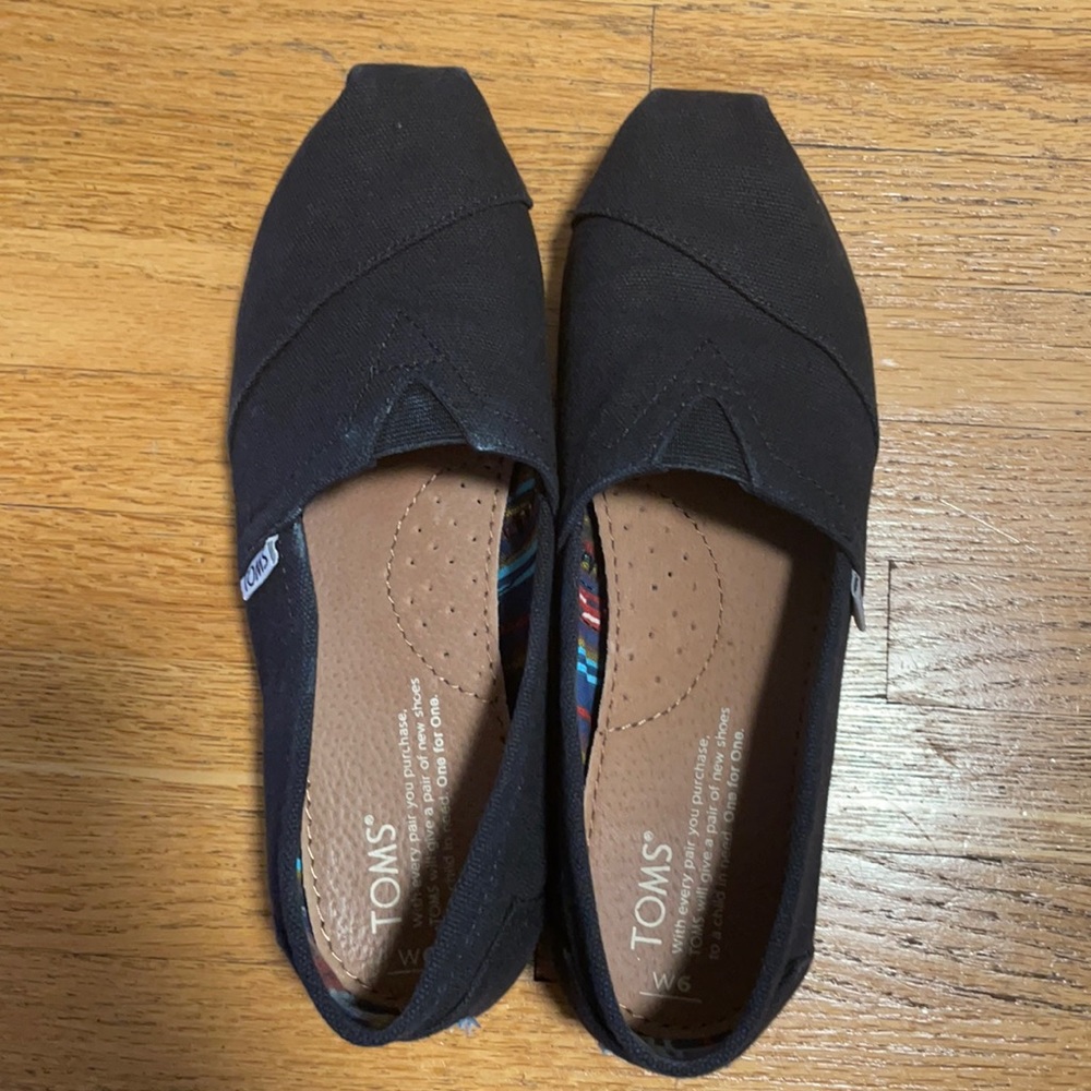 Toms Black on Black Canvas slip ins